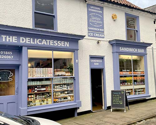 Upstairs Downstairs is a tearooms, delicatessen and sandwich bar overlooking the market place in Thirsk, we are proud to support local suppliers